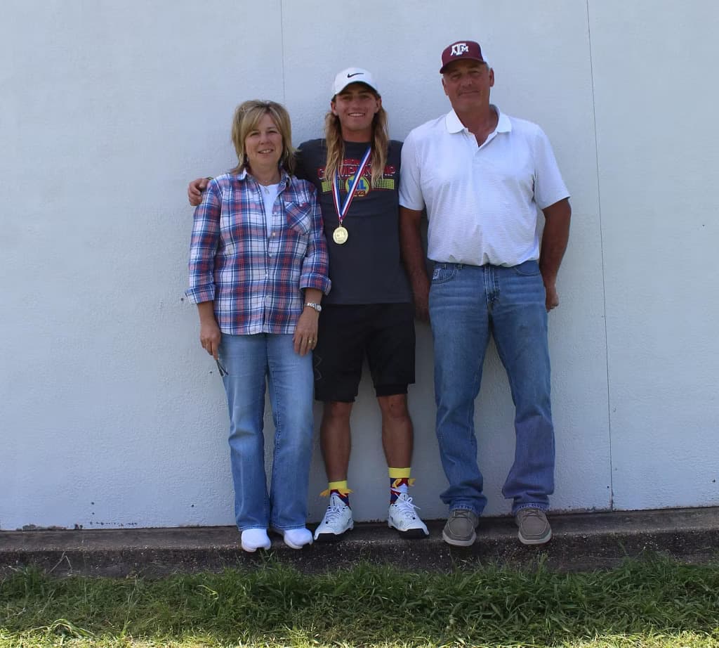 Slone Early with his parents, Sam and Se'Vette Early
